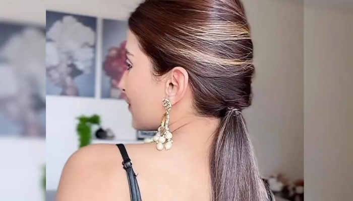 Sleek Ponytail with a Twist